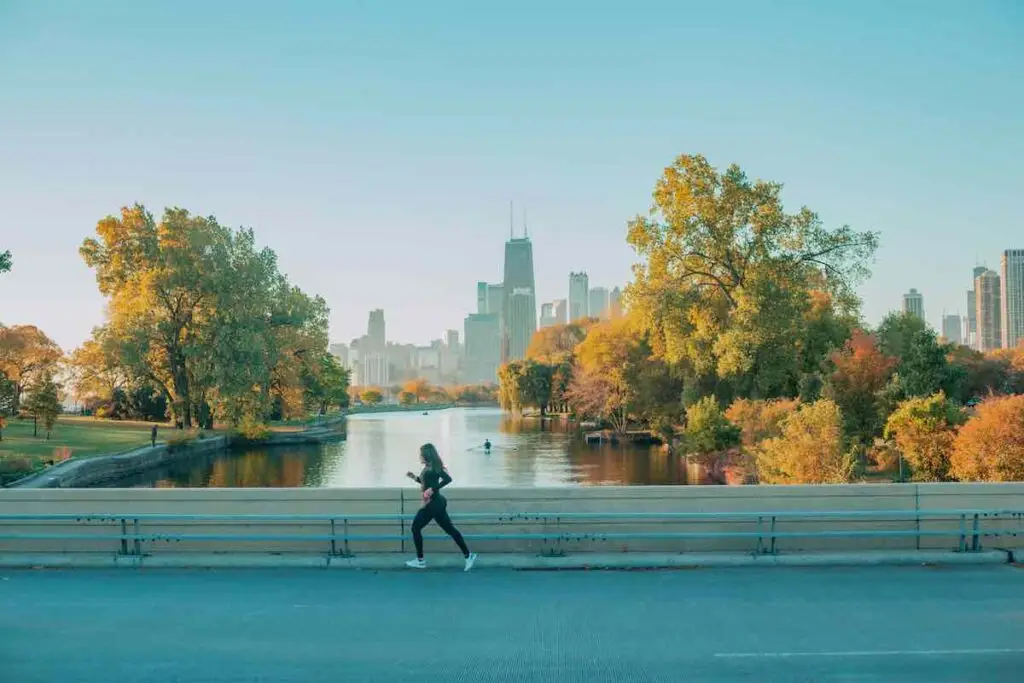 Urban runner on a bridge overlooking Chicago