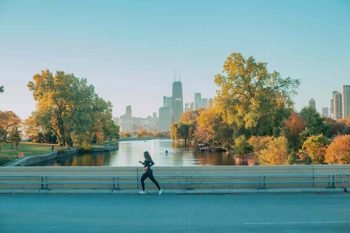 Urban runner on a bridge overlooking Chicago