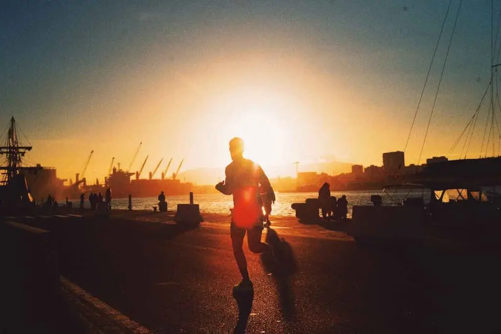 Running near water at sunrise